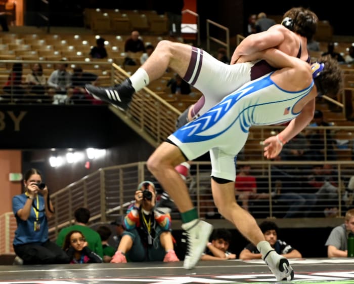 Dominic Bambinelli of Mill Creek wins the 175-pound championship against Gunner Holland of Osceola, 4-2, on Saturday at the Knockout Christmas Classic at Silver Spurs Arena in Kissimmee.